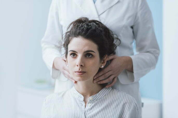 doctorCheckingNeck cervical facet joint injection - doctor checking patients neck
