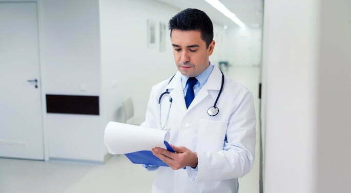 doctorClipboard lumbar facet injection - doctor holding clipboard