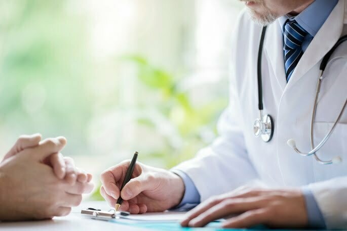 A doctor informing a patient about Diagnostic Medial Branch Block