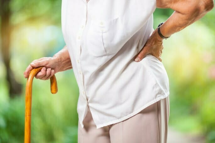 elderlyWomanBackPain Thoracic Epidural Steroid Injection - elderly woman holding her back