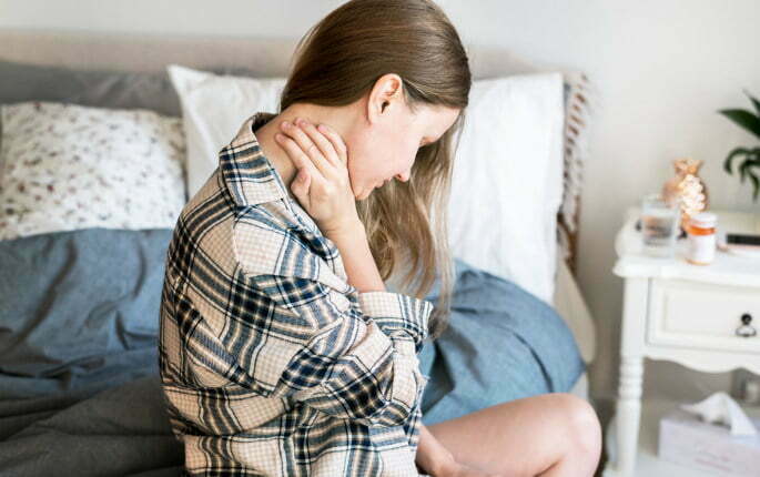 Caucasian girl wake up with neck pain Cervical Radiofrequency Neurotomy - Woman having neck pain while grabbing her neck