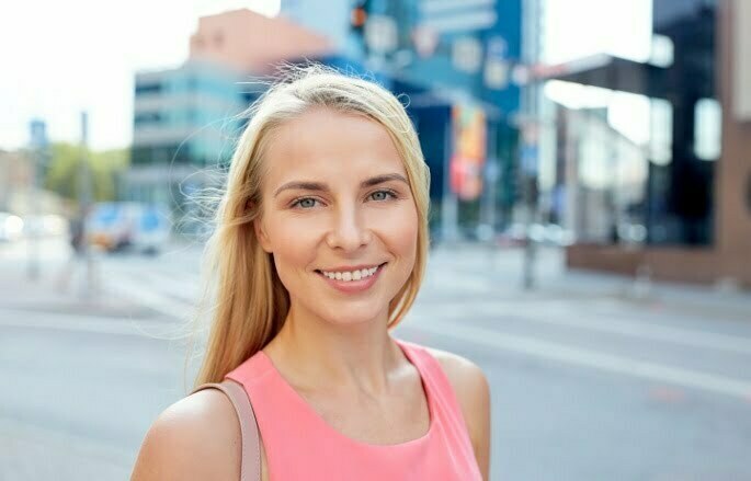 A smiling woman who is happy because she got a Diagnostic Medial Branch Block