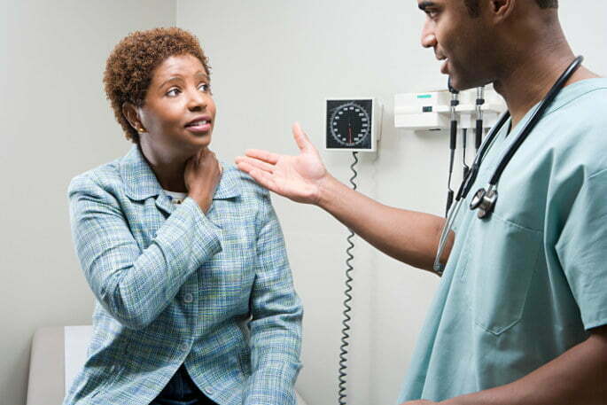lumbar facet injection - doctor and patient talking