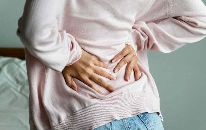 Epidural Steroid Injections - woman holding lower back in pain