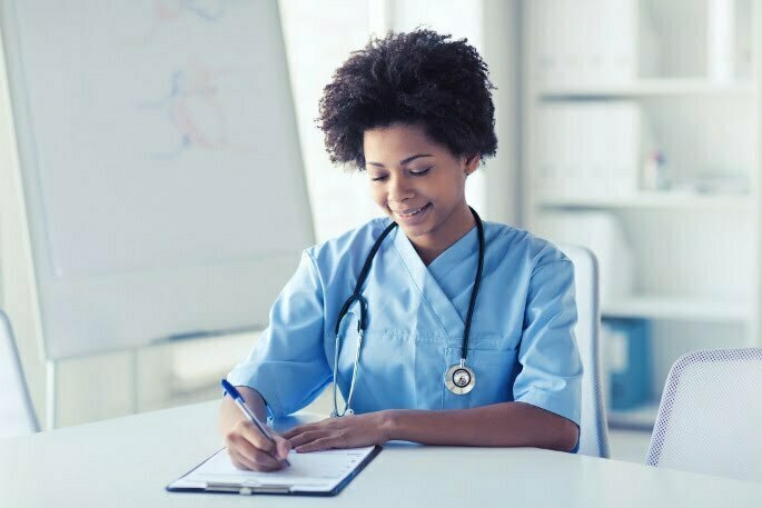 Nurse Writing on Clipboard