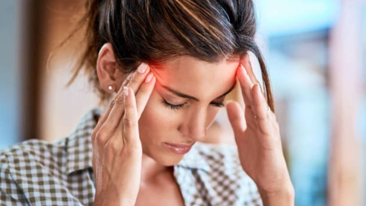Woman Experencing A Migraine Headache